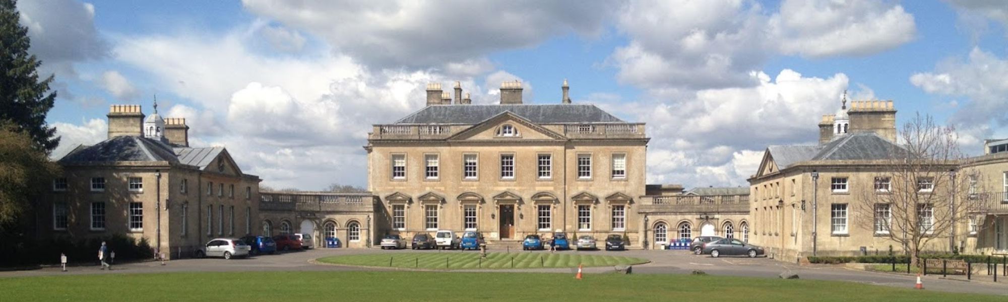 Bath Spa University with cars outside in font of the building  