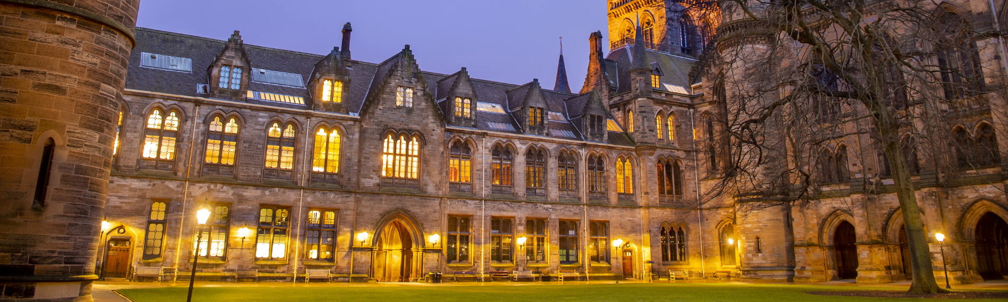 Glasgow University at night with lights on