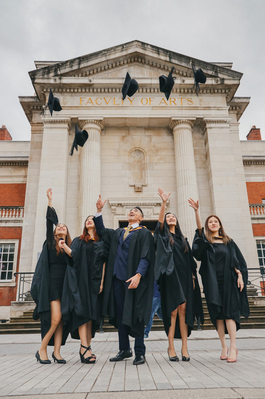 University graduates throwing their caps in the air 