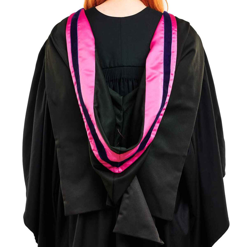 Premium Photo | Annoyed young girl holding white idea board and wearing graduation  gown on pink wall.